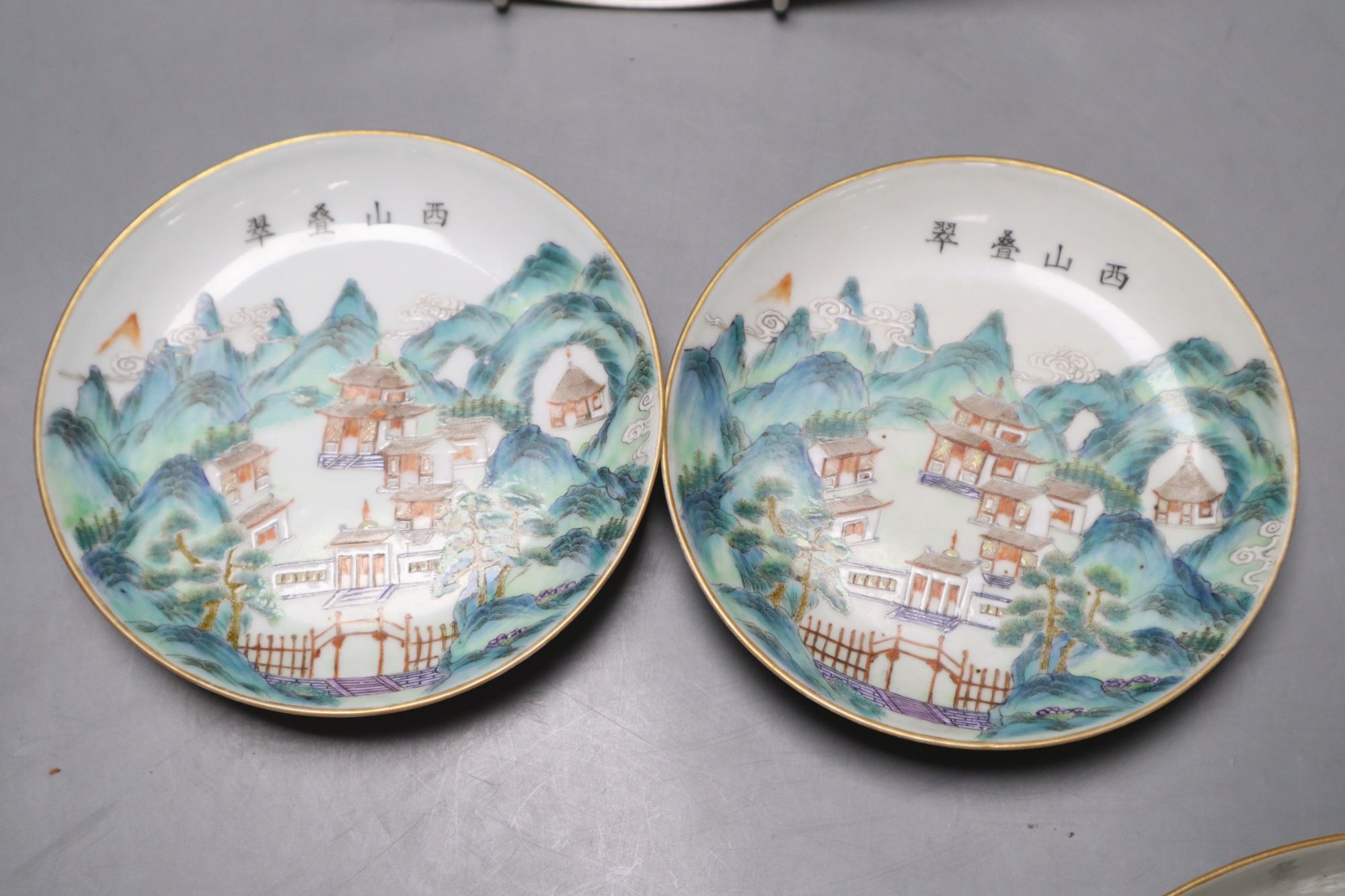A pair of Chinese enamelled porcelain saucer dishes and two similar smaller bearing Daoguang marks, largest diameter 21cm